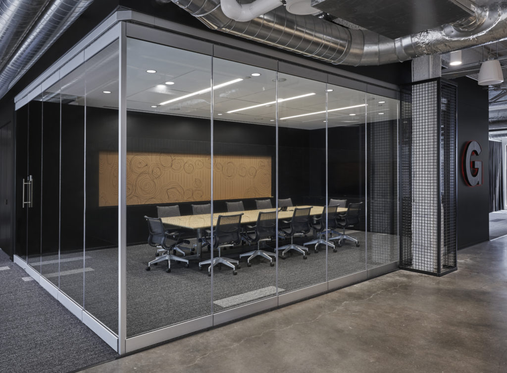 Carvart glass wall surrounding meeting room